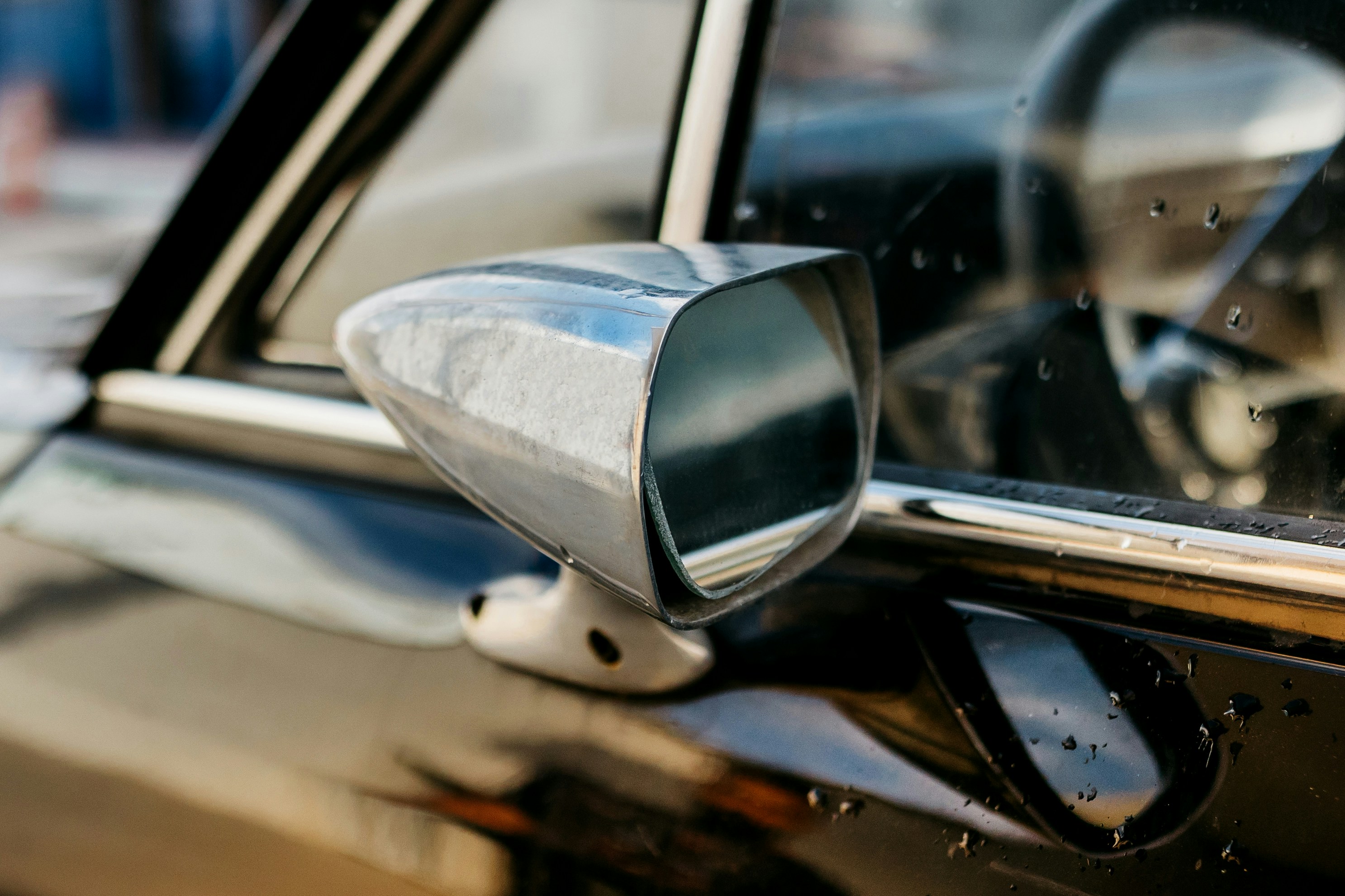the side view mirror of a car is shown