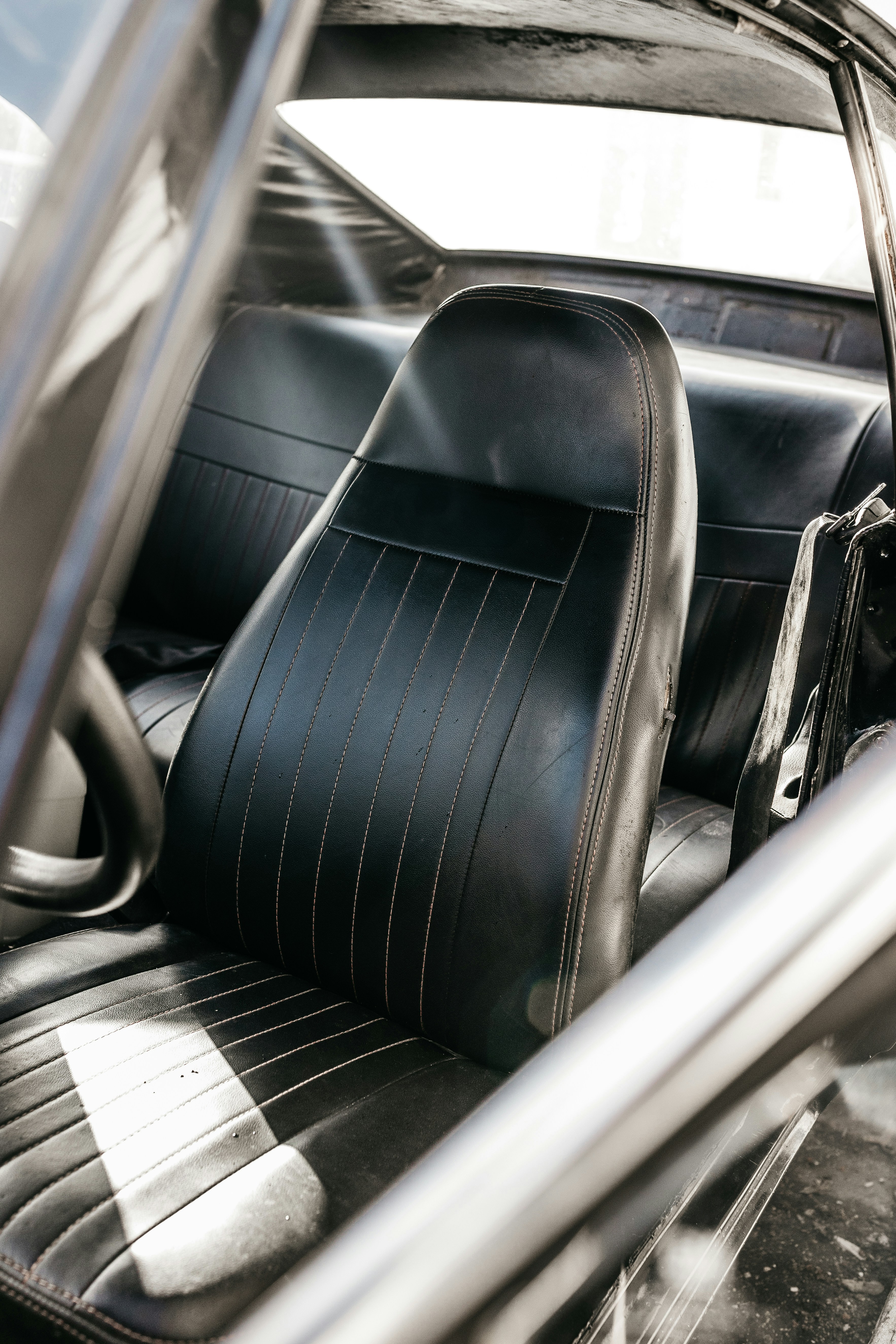 the interior of a car with black leather seats