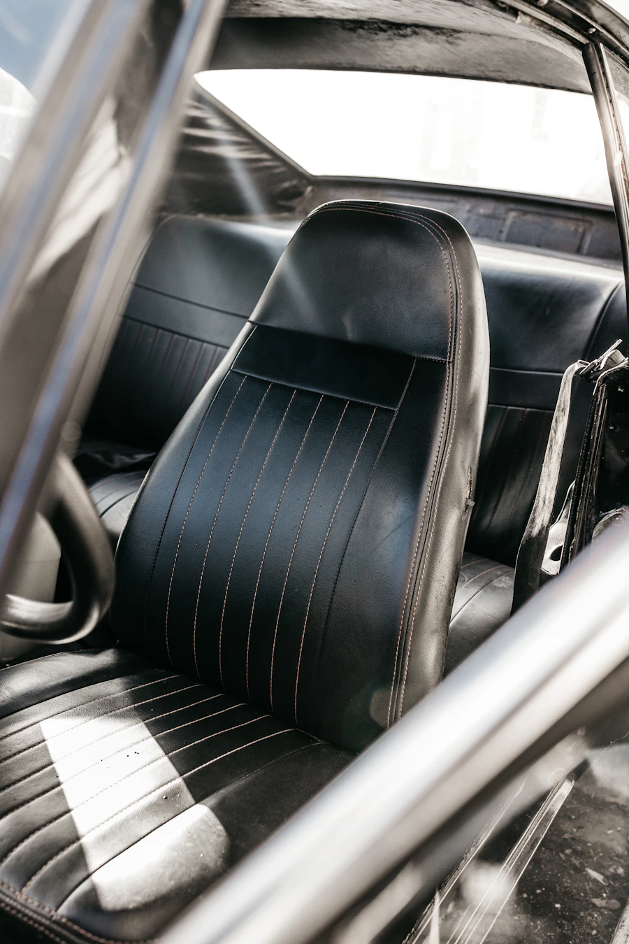 Black leather seating inside a passenger vehicle