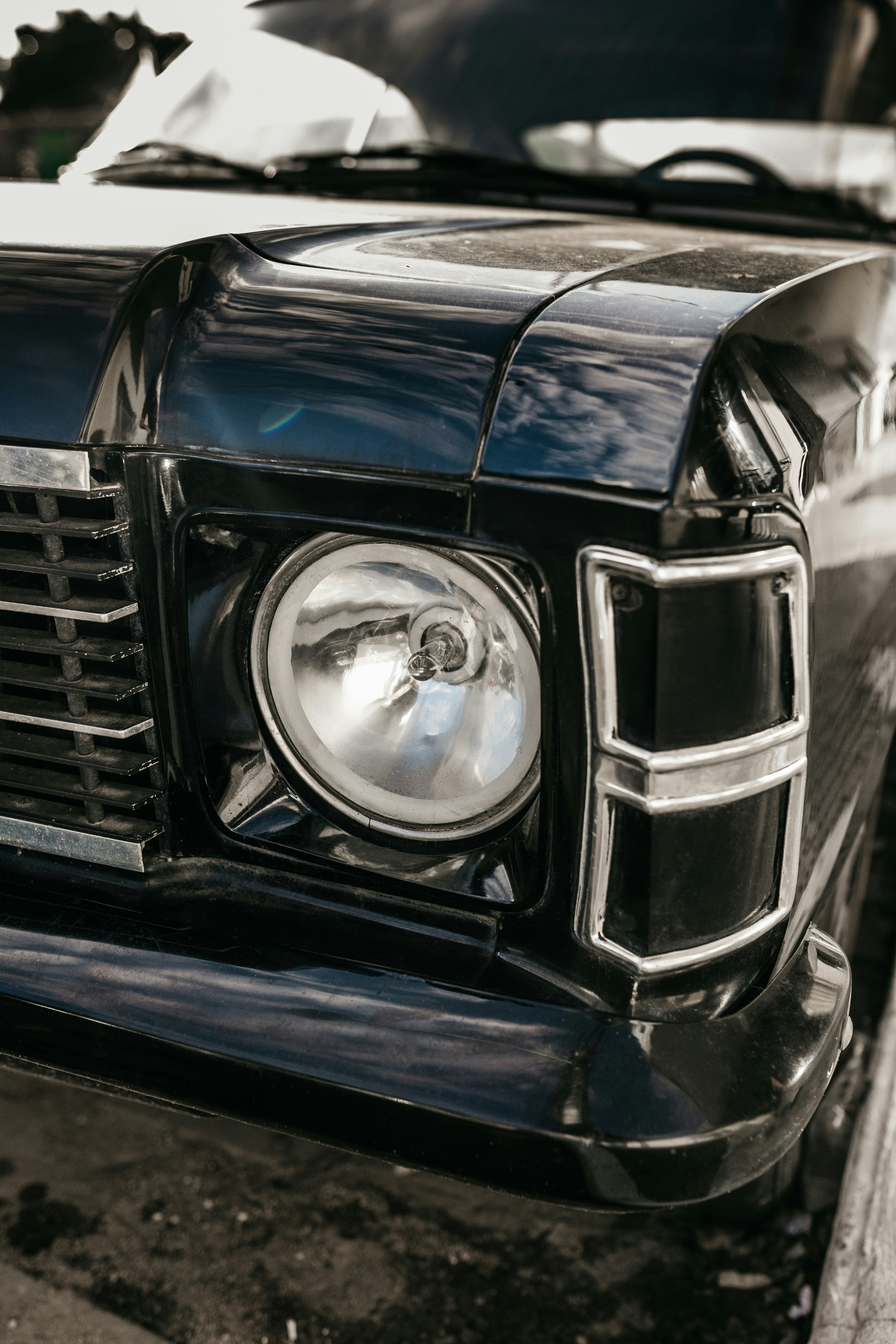 a close up of a black and white photo of a car