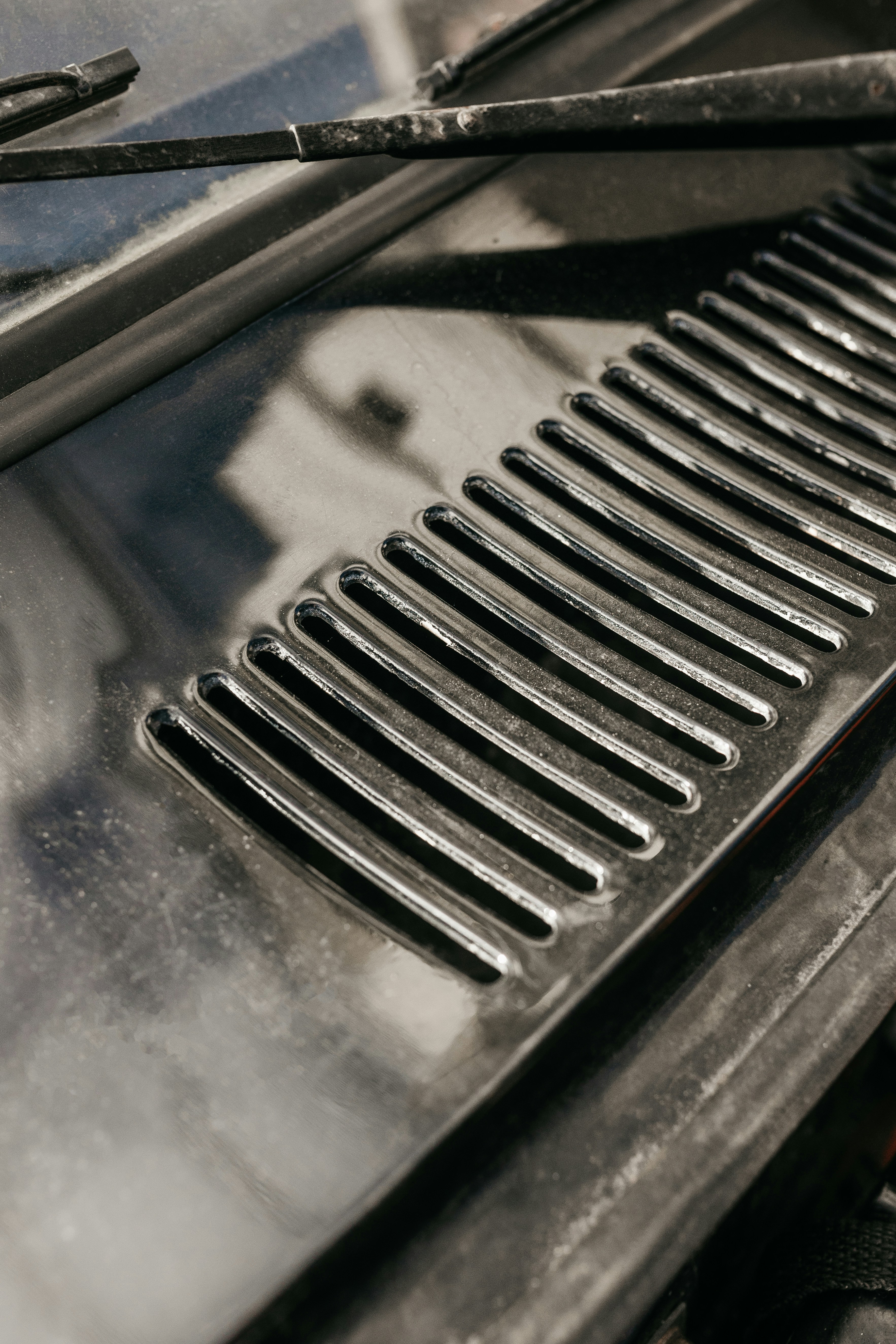 a close up of a grill on a car