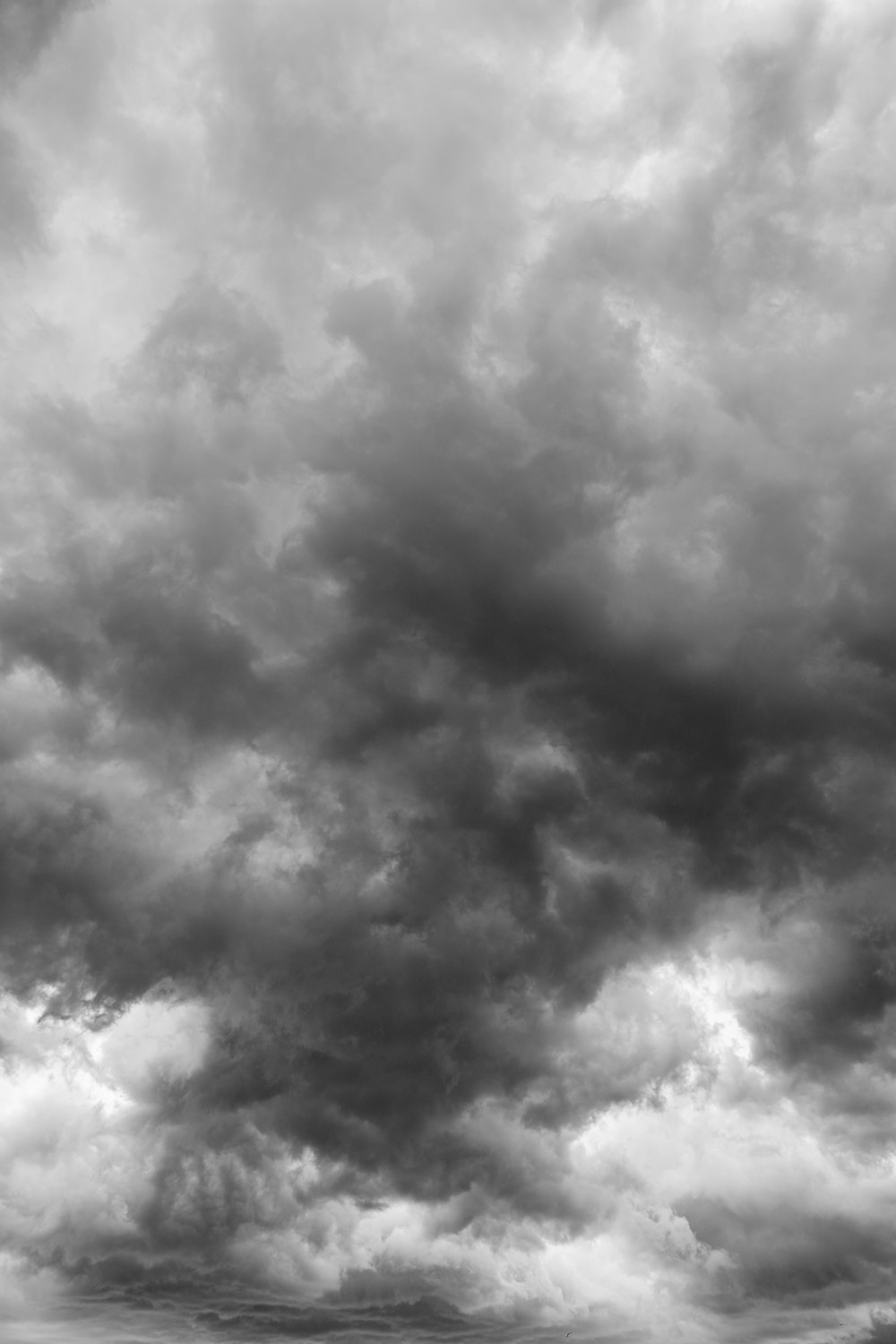 a black and white photo of a cloudy sky