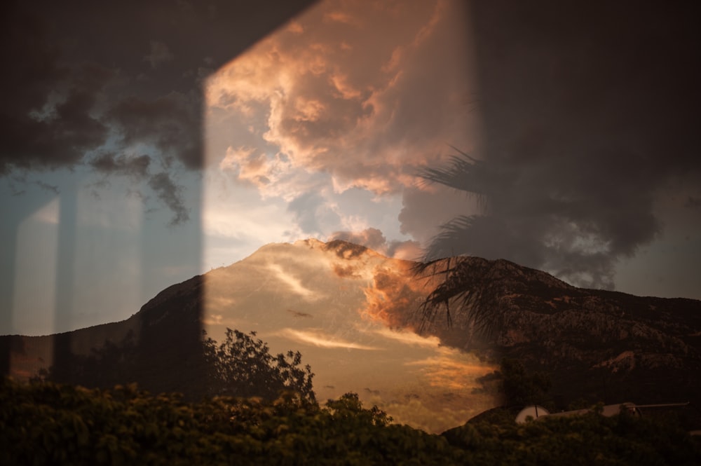 a reflection of a mountain in a mirror
