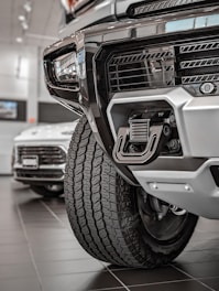 Close-up of rugged truck accessories displayed on a workshop bench.