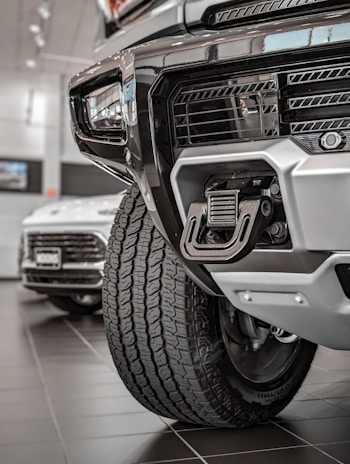 Close-up of the heavy-duty trailer hitch connecting to a reliable towing vehicle under soft daylight.