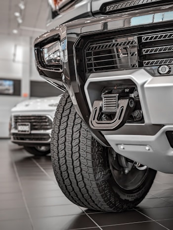 Close-up of a trailer hitch and sturdy tires, highlighting quality craftsmanship.