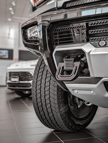 Close-up of a customer happily browsing the Isuzu truck online store on a tablet.