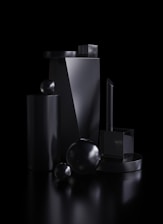 Sleek 3D printed parts arranged on a black surface with yellow lighting accents.