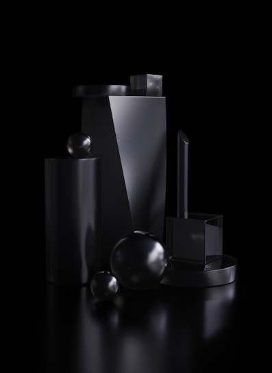 A collection of modern 3D-printed objects displayed on a sleek surface.