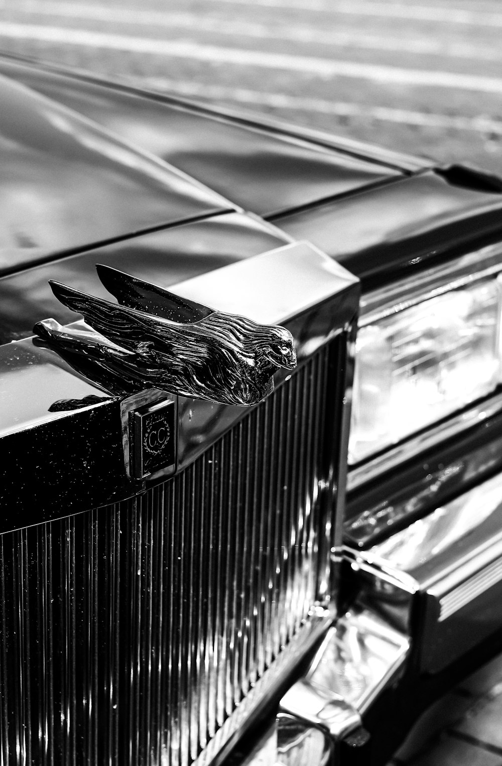 a black and white photo of a classic car