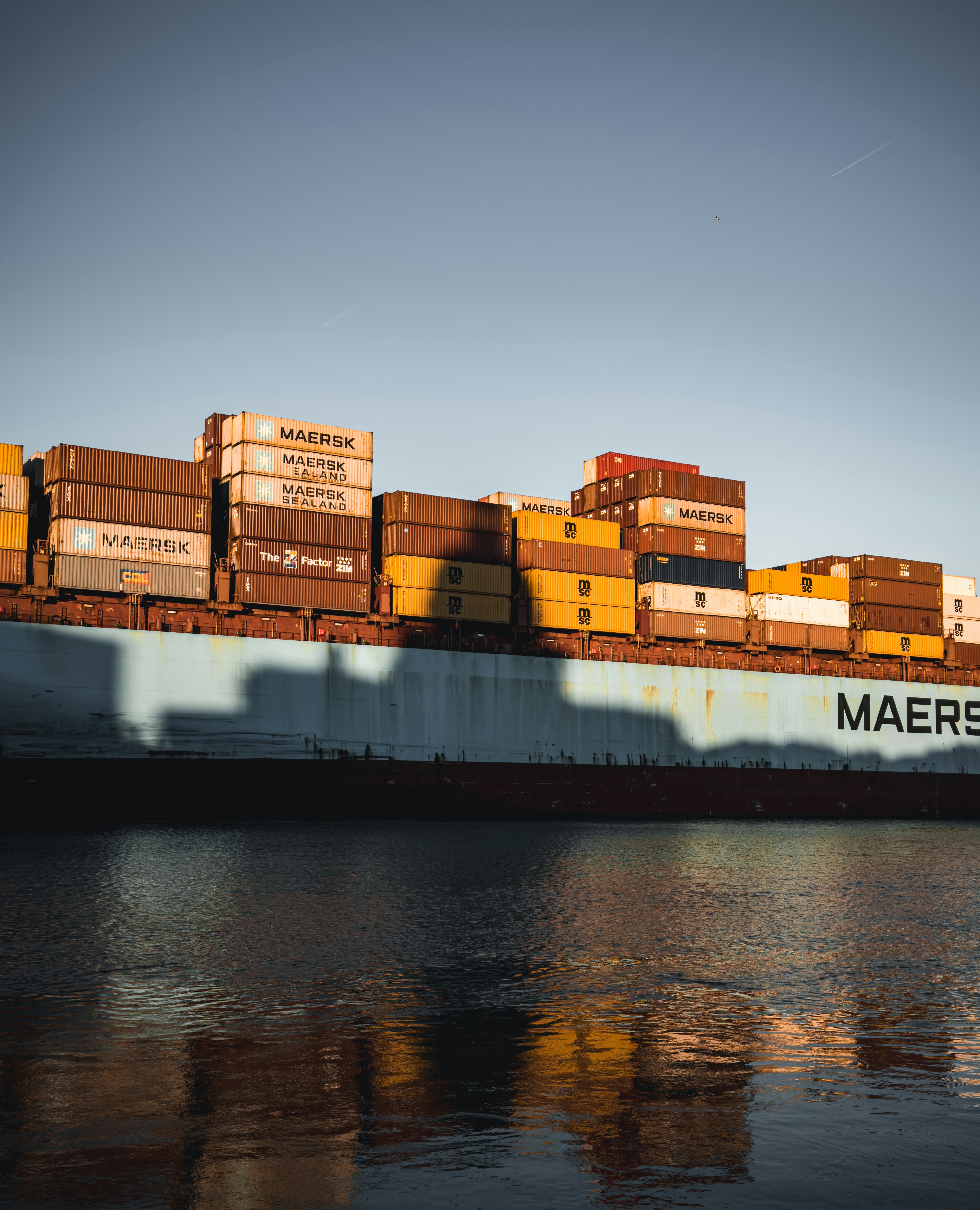 A large cargo ship with stacks of boxes on top of it photo – Free Usa ...