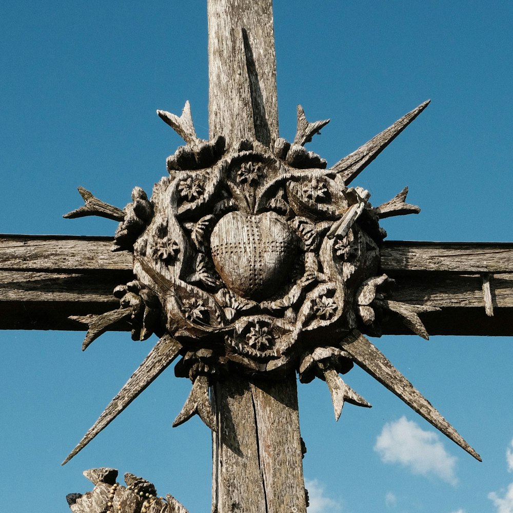a wooden cross with a heart on it