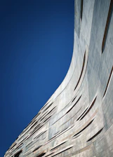 A sleek, modern architectural structure with sharp lines symbolizing forward momentum and growth.