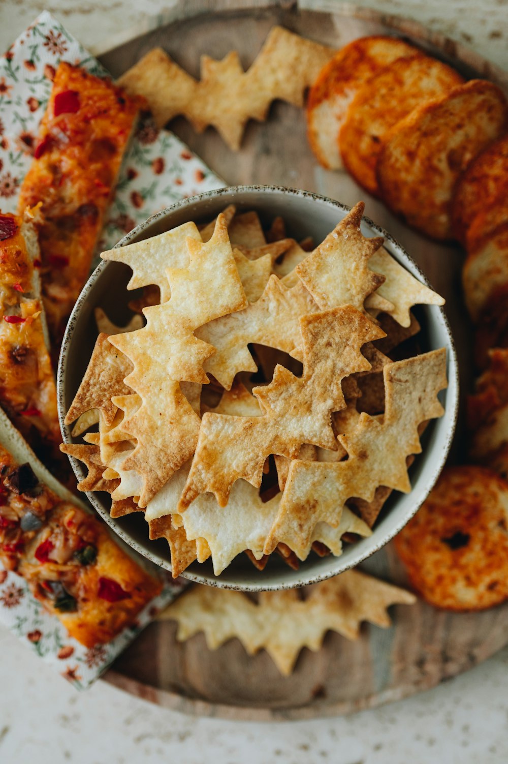 a bowl filled with crackers sitting on top of a table