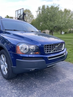A family SUV parked in a driveway.