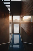 a room with a glass floor and a view of the water