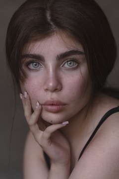 Close-up portrait of a person with expressive eyes and natural light.