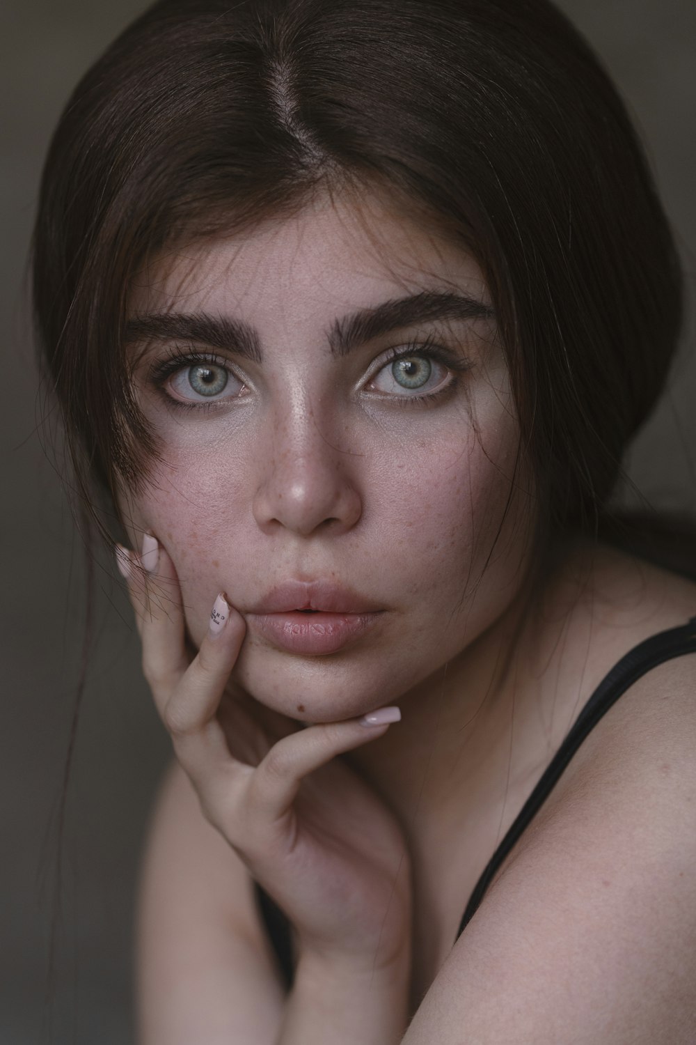 a woman with blue eyes posing for a picture