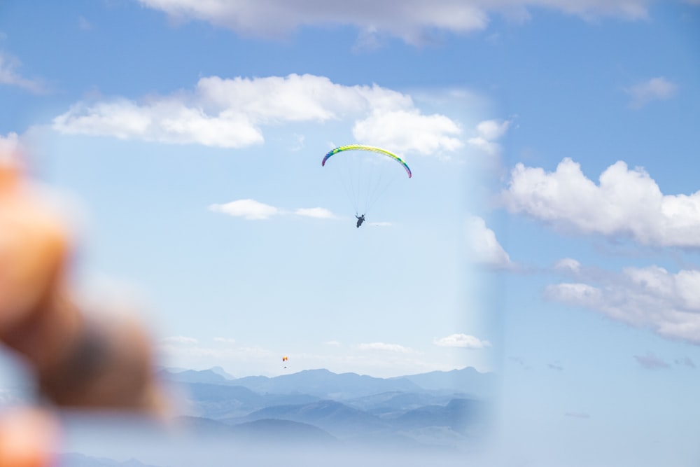 a person is flying a kite in the sky