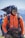 a man wearing a helmet and carrying a backpack
