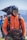 a man wearing a helmet and carrying a backpack
