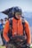 a man wearing a helmet and carrying a backpack