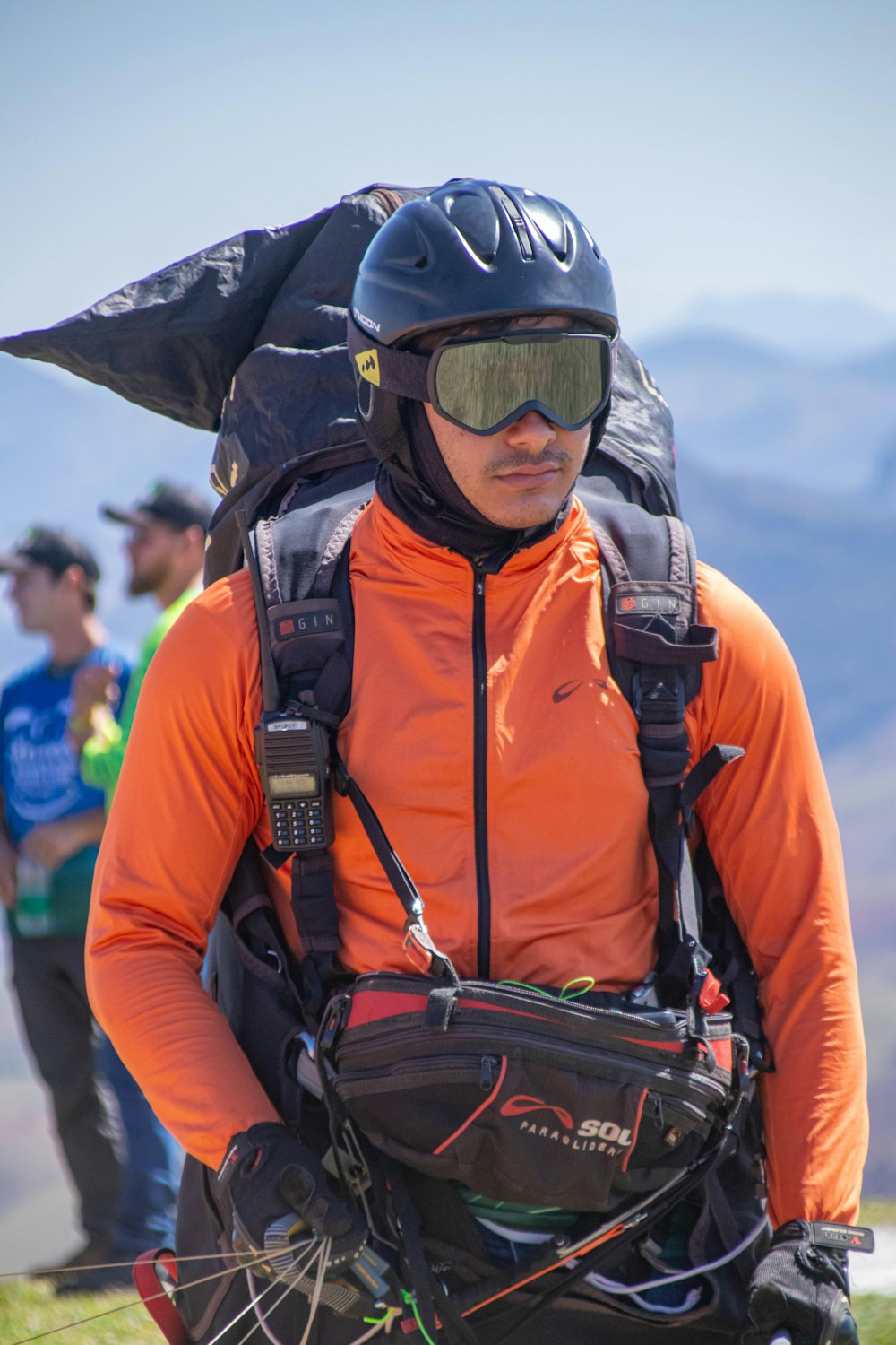 a man wearing a helmet and carrying a backpack