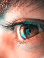 a close up of a person's blue eye