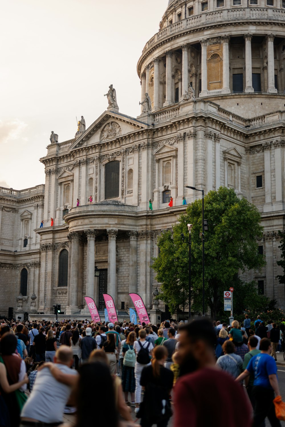 a large group of people standing in front of a building