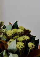 Close-up of a lush bouquet featuring wildflowers and greenery.
