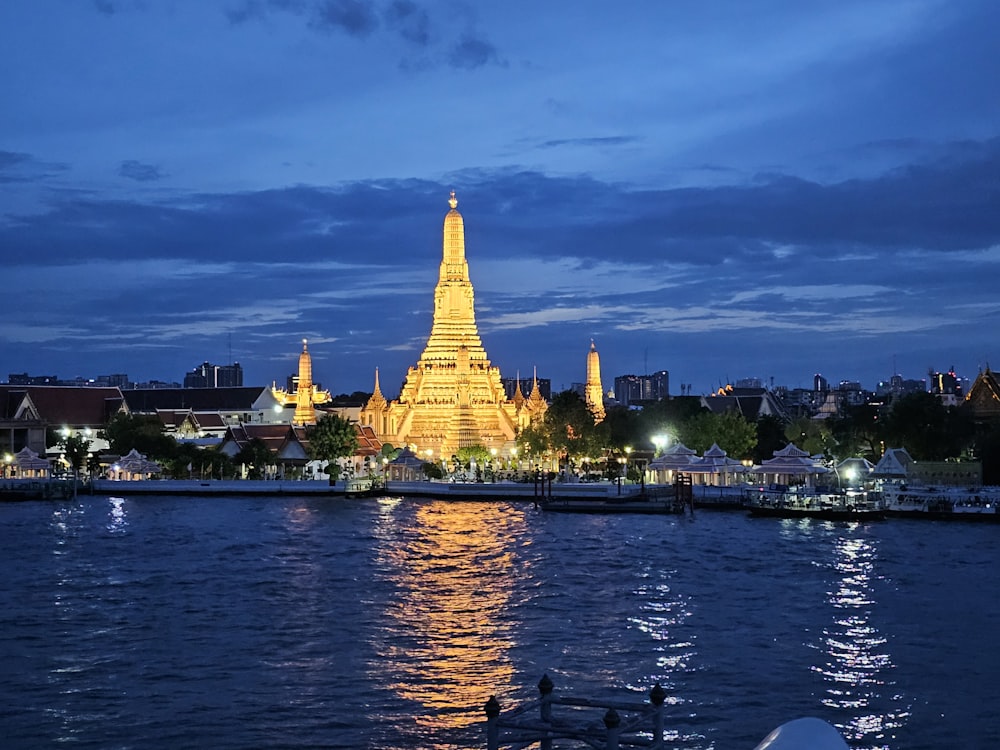 a very tall tower sitting over a body of water