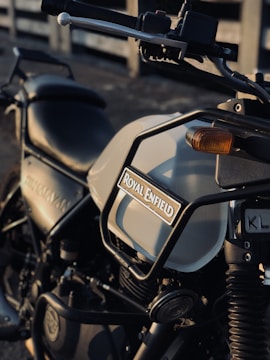 A Royal Enfield motorcycle undergoing custom modifications with attention to detail.