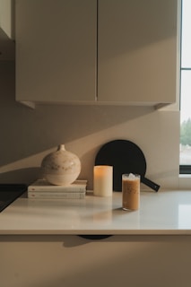 A cozy kitchen scene with a stack of affordable cooking books featuring beach recipes
