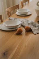 A beautifully crafted wooden dining table set in a modern home.