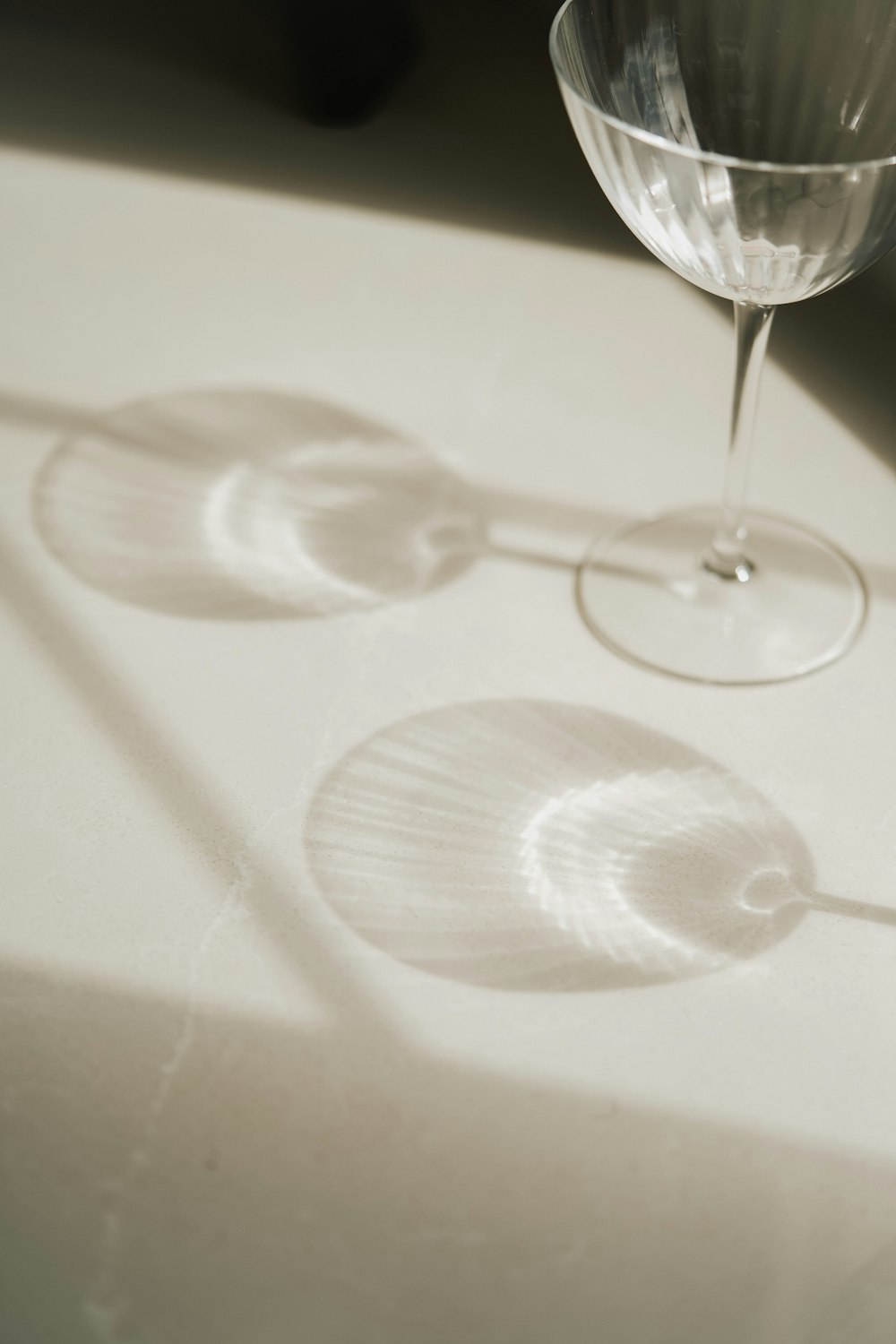 a wine glass sitting on top of a table