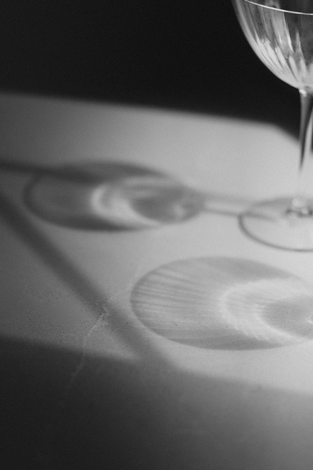 a close up of a wine glass on a table