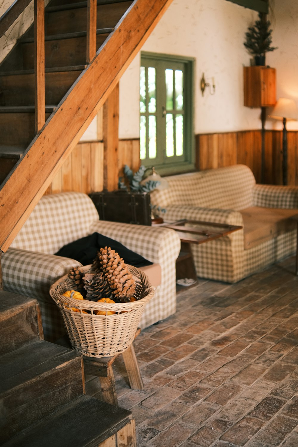 a living room filled with furniture and a staircase