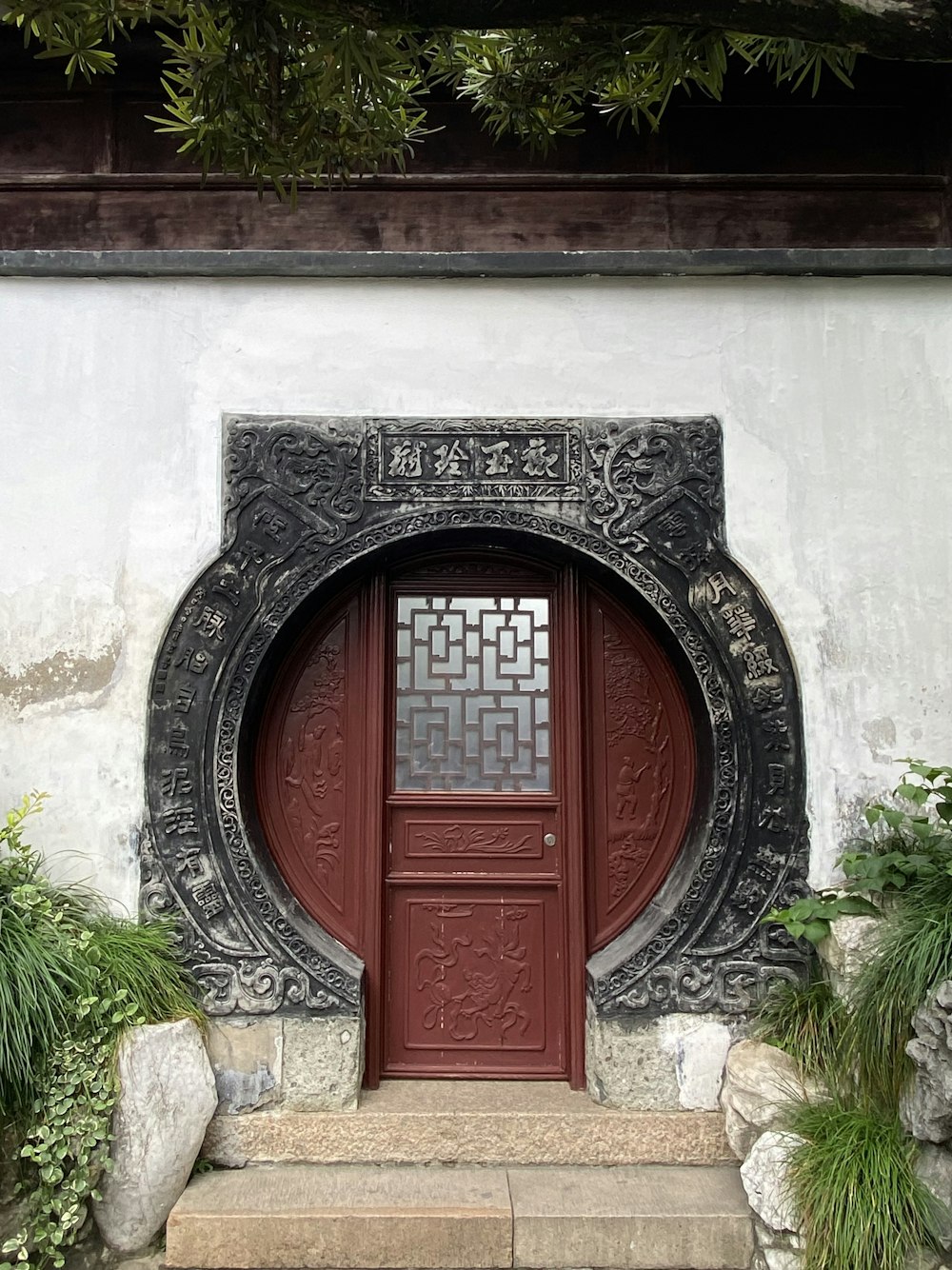 a red door is on a white wall