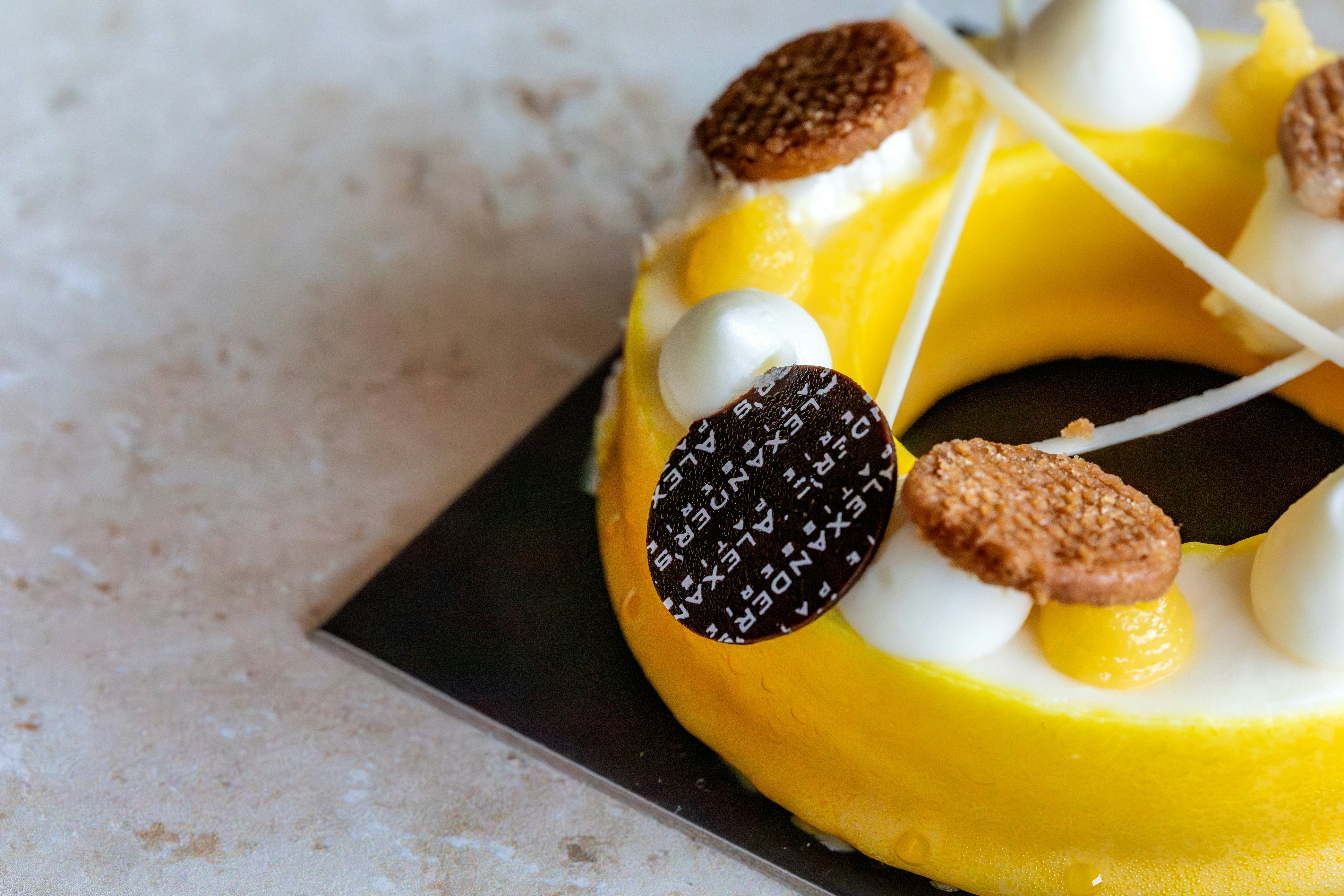 a yellow cake with marshmallows and cookies on top