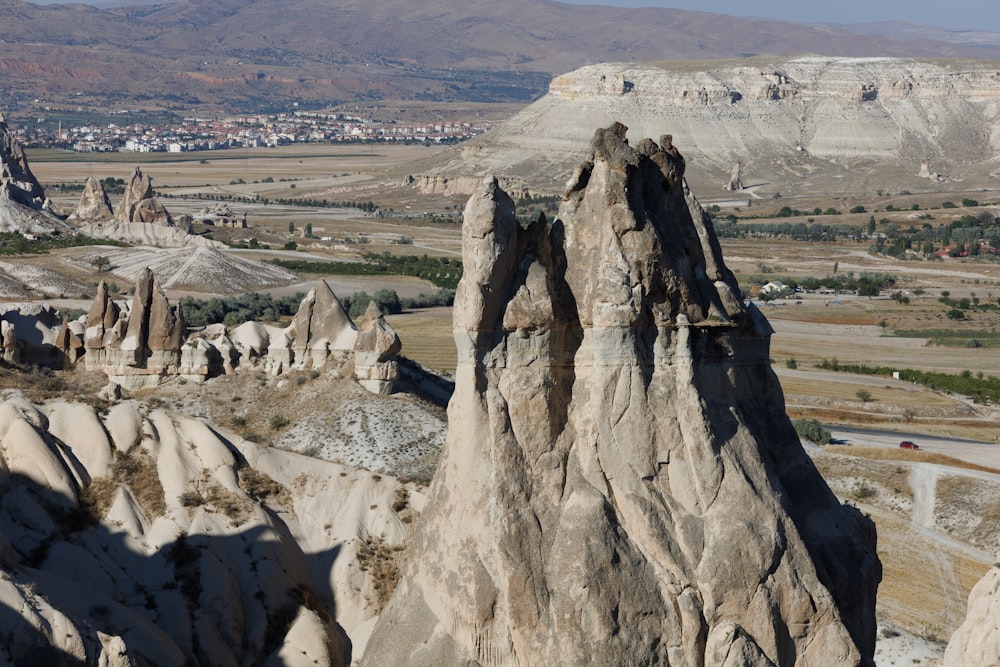 a rocky landscape with a valley in the background