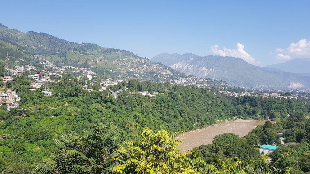 a river running through a lush green hillside