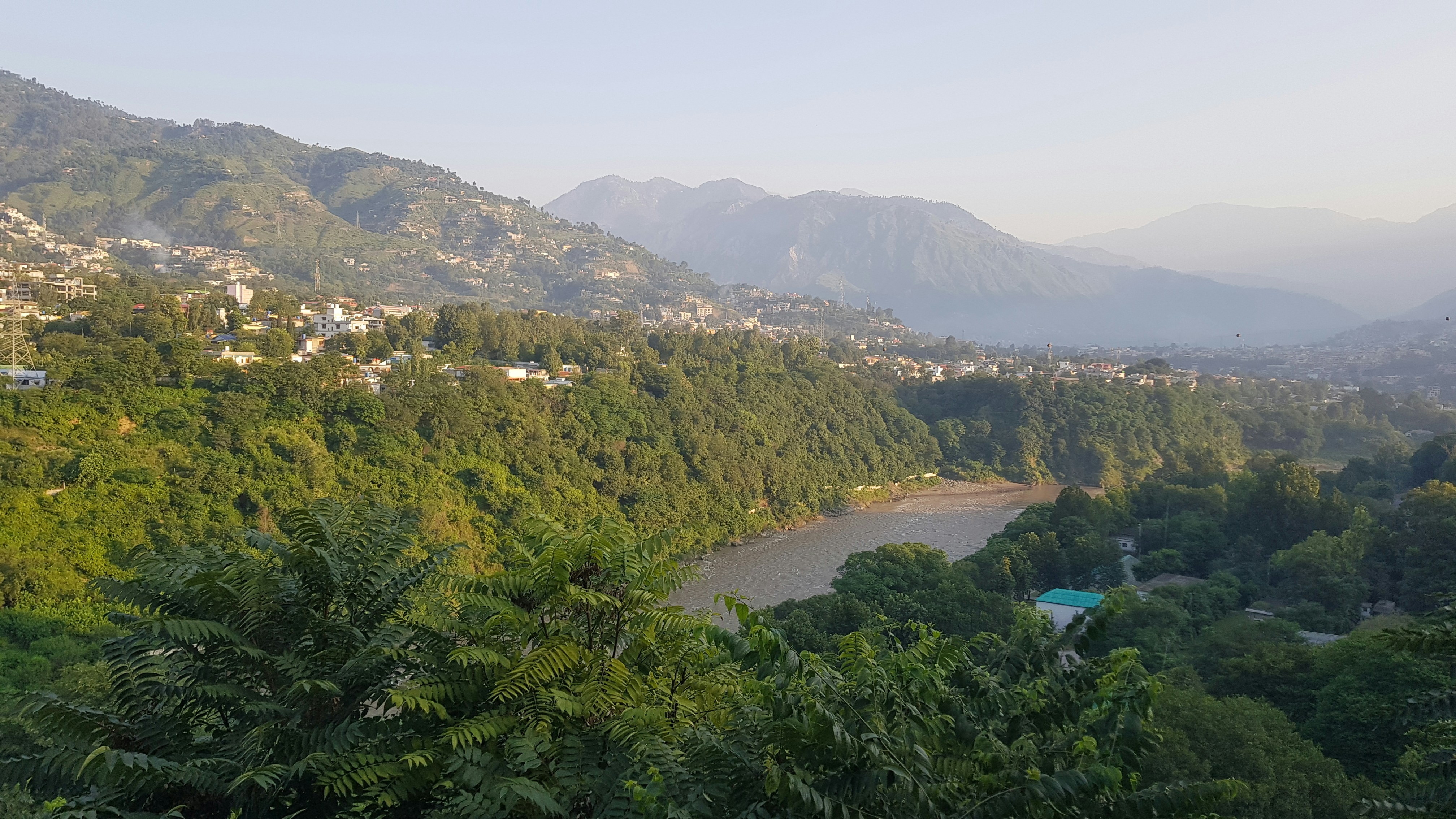 a view of a valley with a river running through it