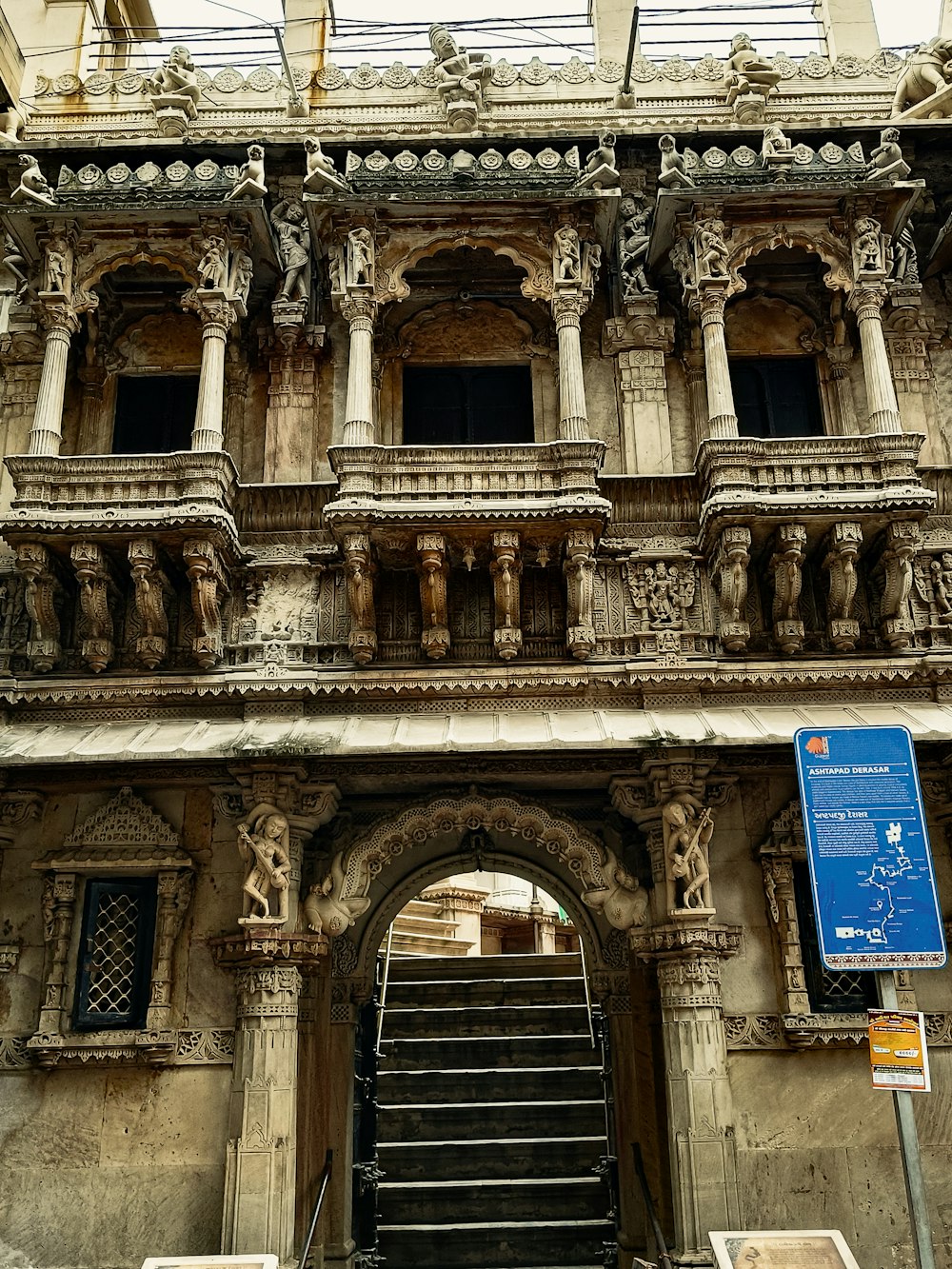 an old building with a staircase leading up to it