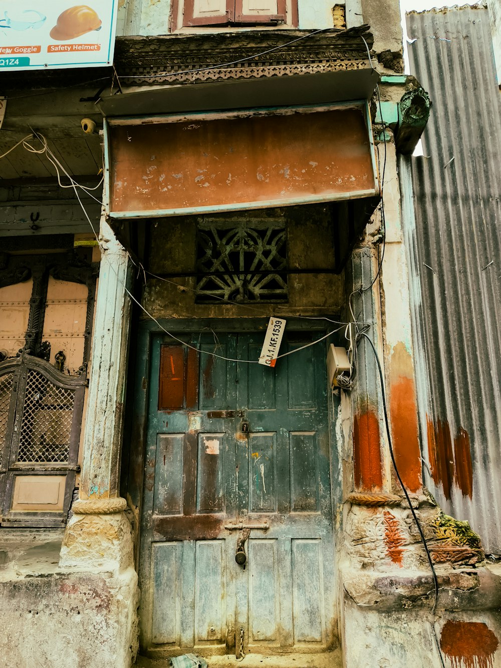 an old building with a sign on the door