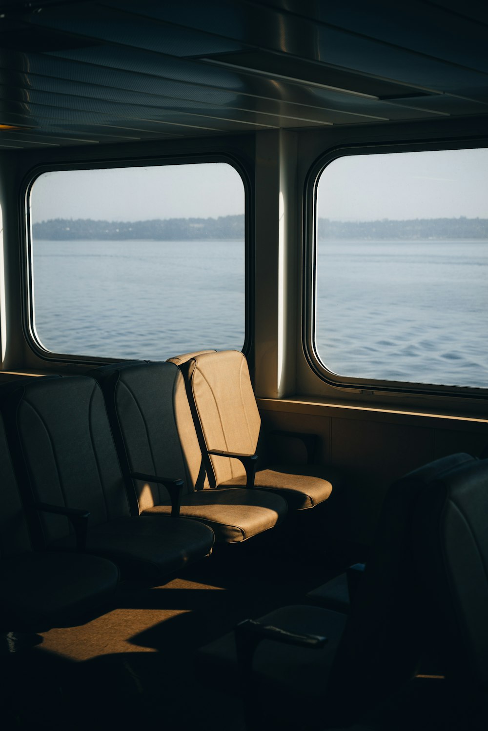 a row of seats sitting on top of a boat
