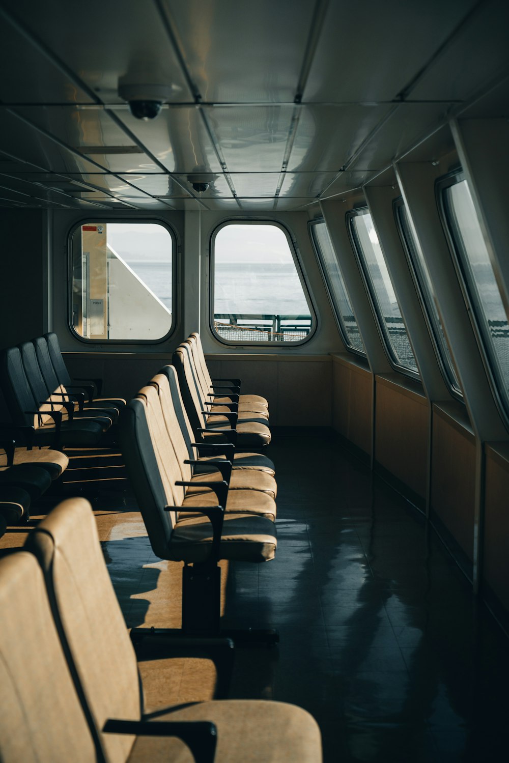 a row of seats sitting on the side of a boat