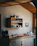 Modern minimalist kitchen set with clean lines and wooden accents in a cozy home setting.
