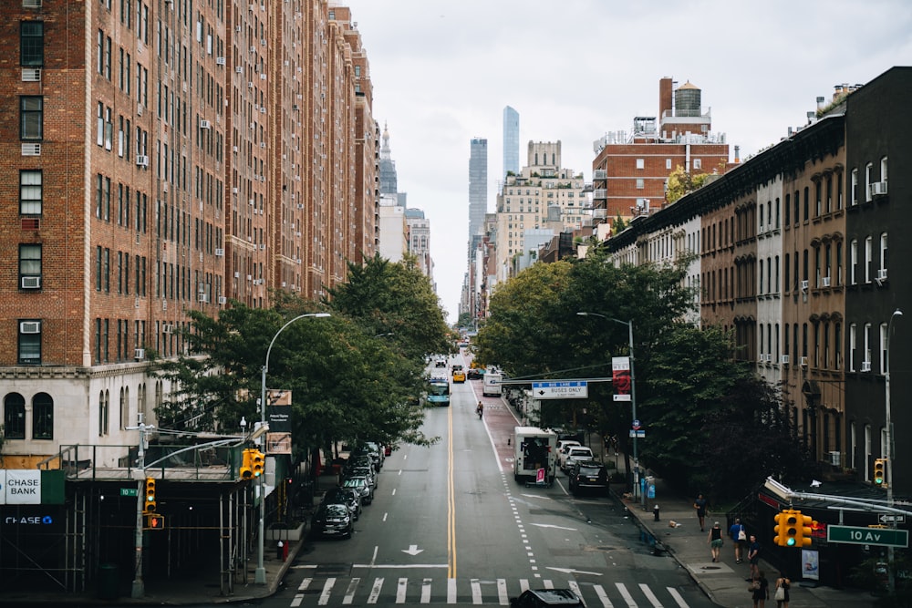 a view of a city street with tall buildings