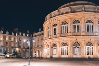 a large building with a lot of windows at night