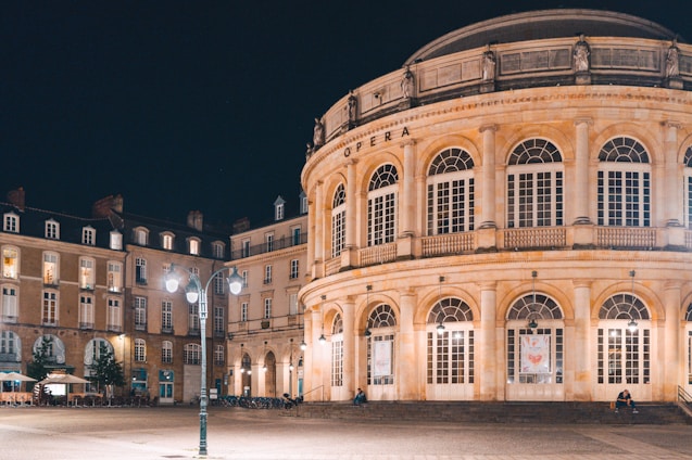 a large building with a lot of windows at night